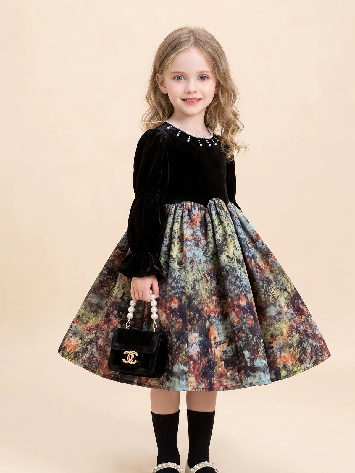 Black velvet party dress with pearl details, detail view